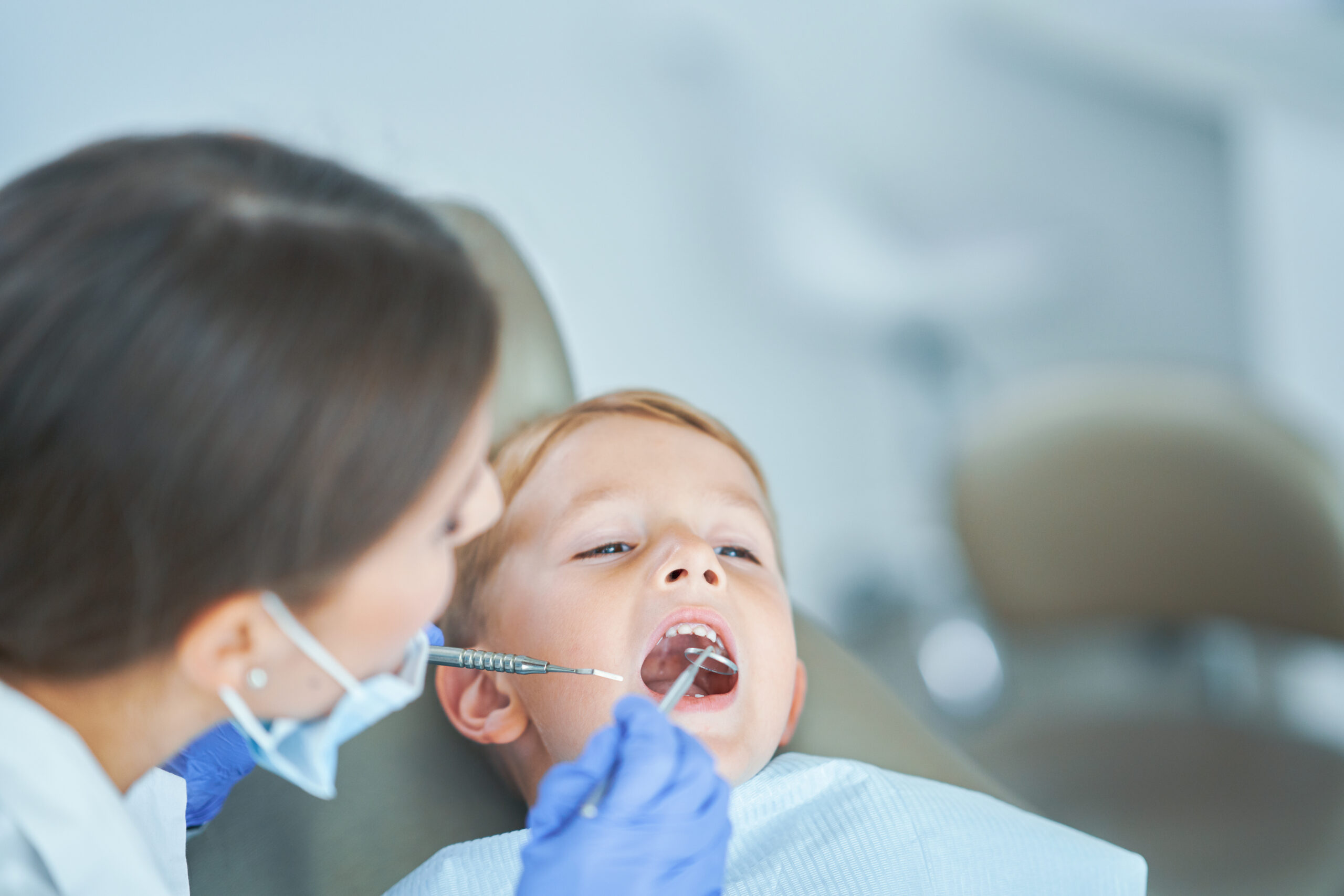 Little boy sitting in the dentists office
